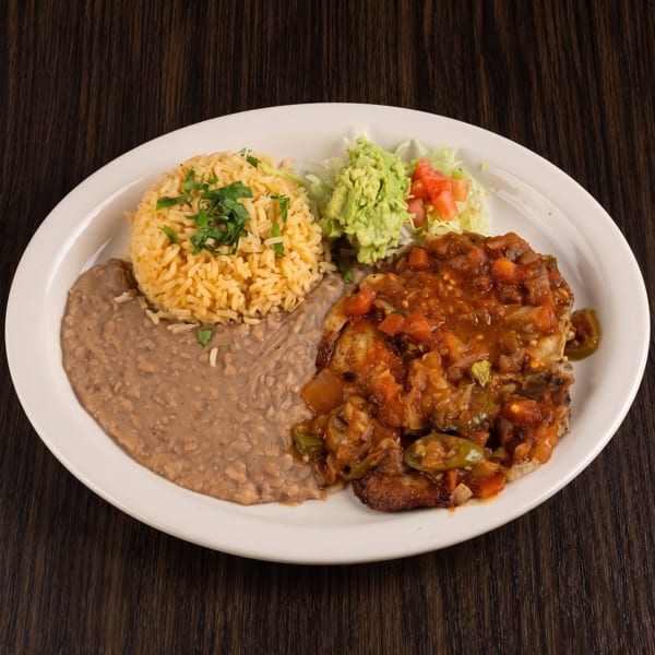 Mexican-style platter with grilled chicken in tomato salsa, cilantro rice, refried beans, guacamole, and salad.